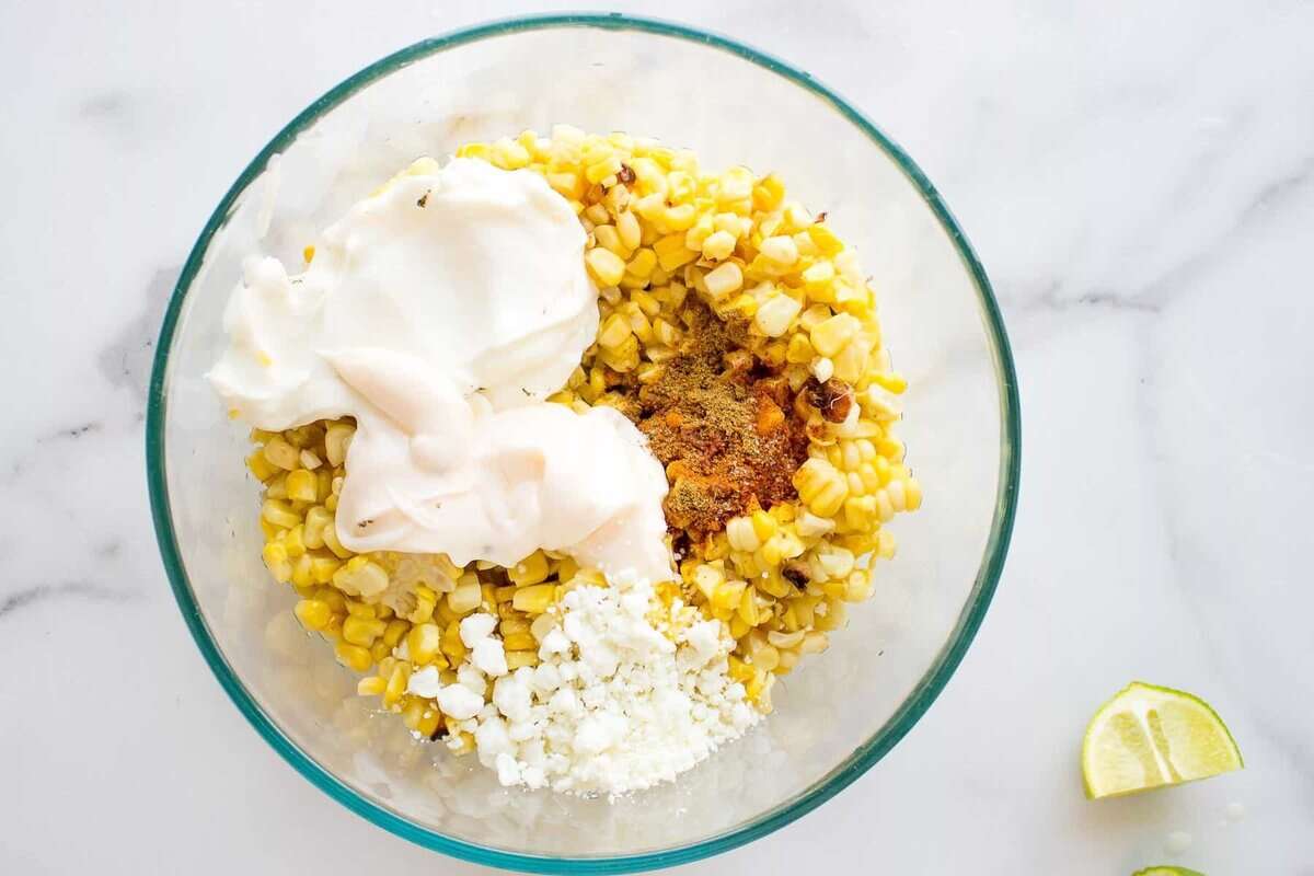 Ingredients for Mexican corn in bowl before stirring.