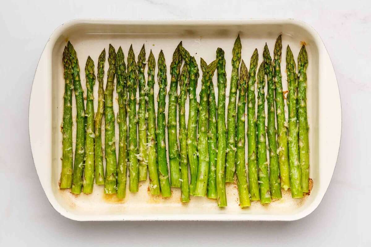 Parmesan roasted asparagus in baking dish.