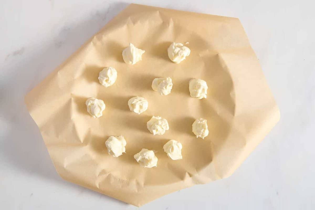 Balls of cheesecake filling for strawberry cookies.