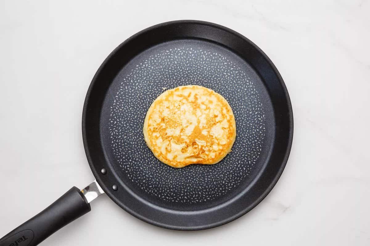 Banana pancake in skillet.