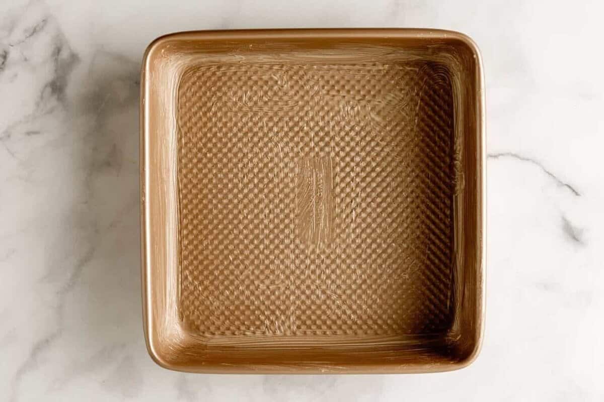 Greased square baking dish.