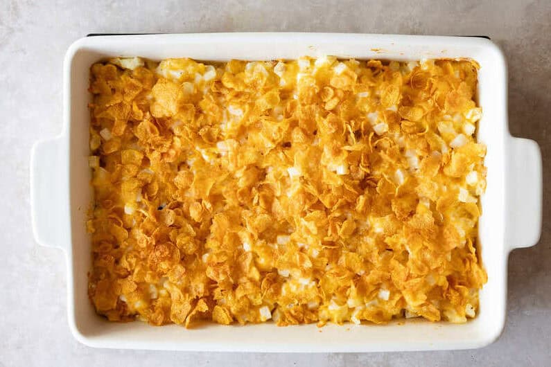 Overhead view of easy cheesy potatoes in baking dish