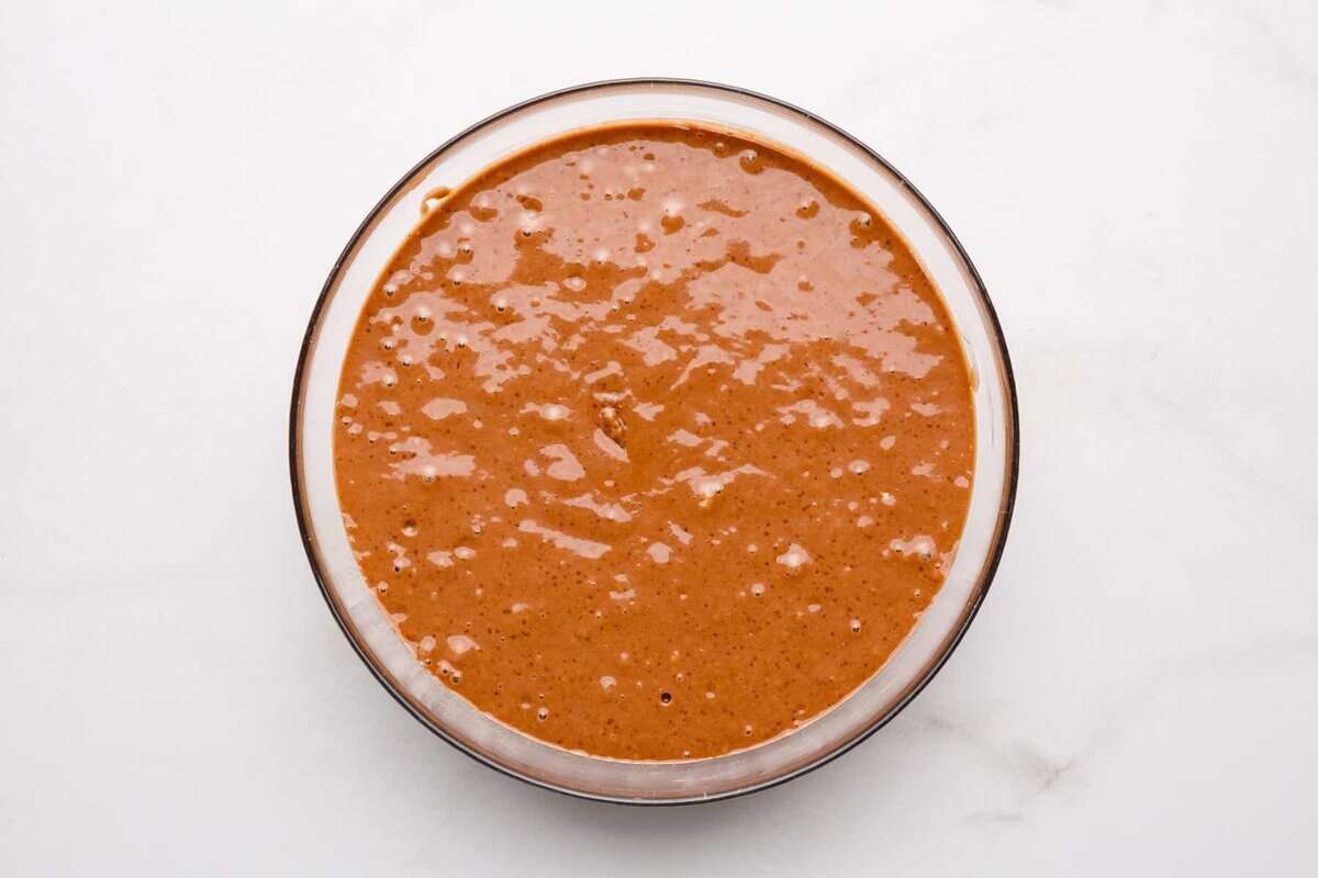 Chocolate waffle batter in glass bowl.