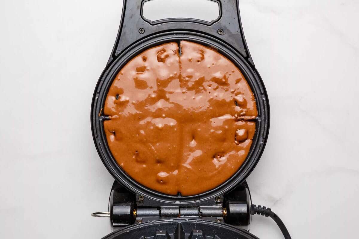 Chocolate batter in waffle maker.