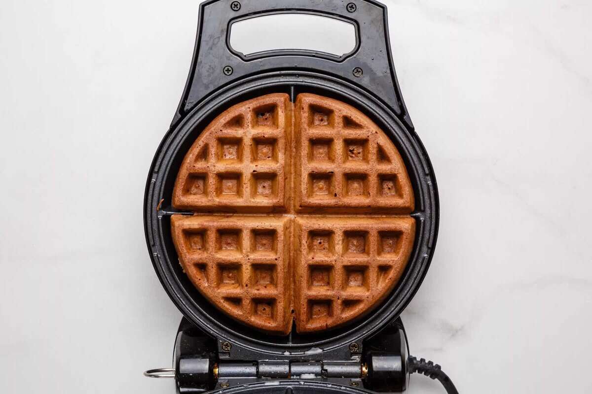 Chocolate waffle in waffle maker.