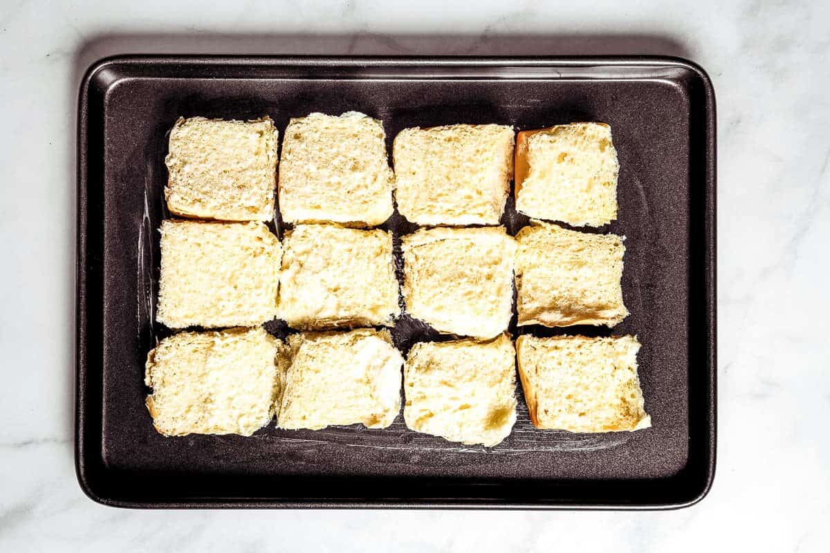 Bottoms of slider rolls on sheet pan.