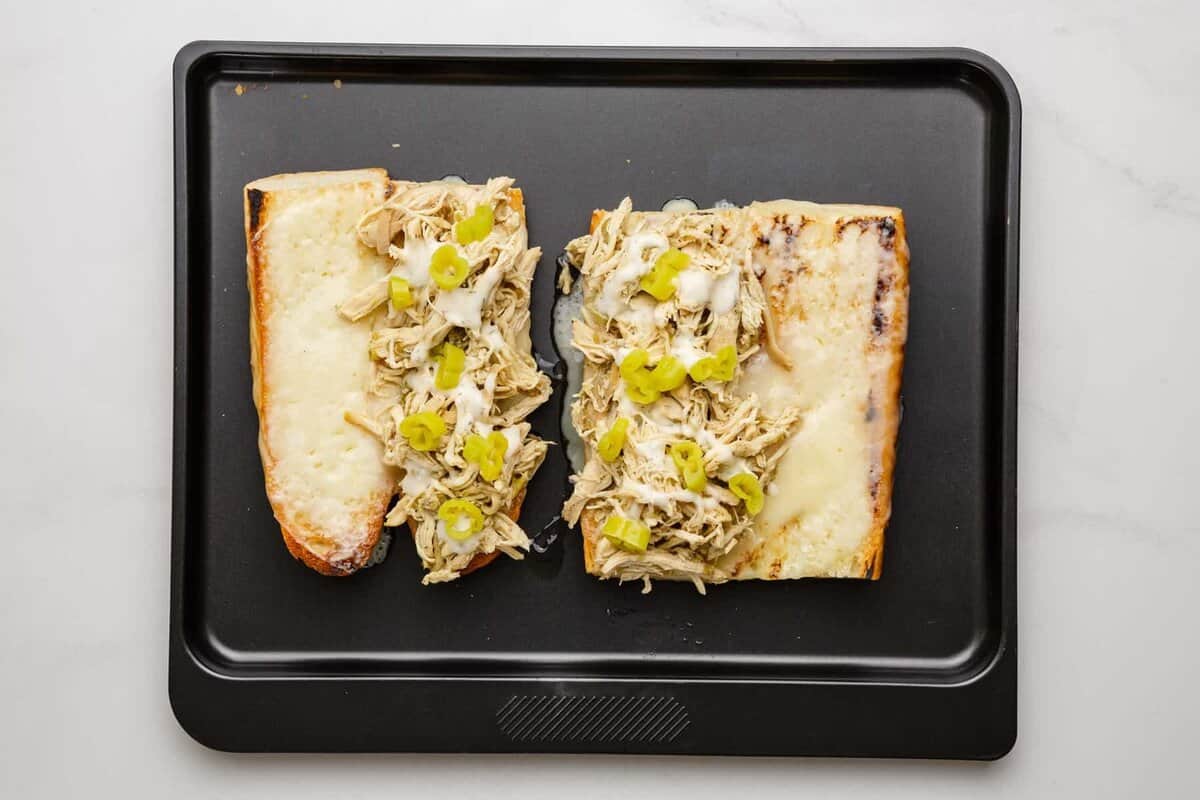 Assembled slow cooker Italian chicken sandwiches.