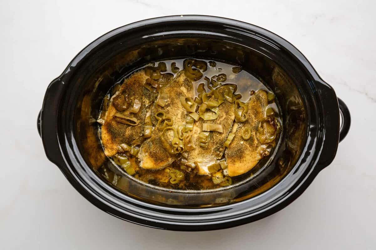 Cooked Italian chicken in slow cooker.