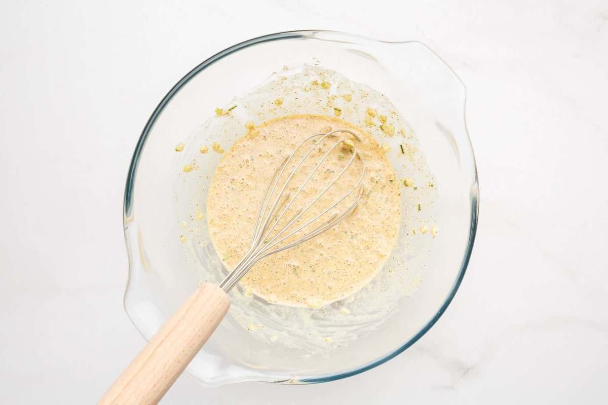 Wet ingredients in bowl for crab cakes.