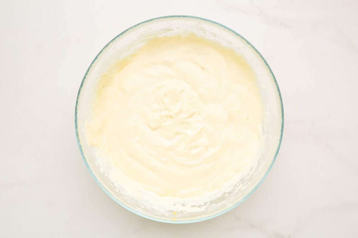 Pancake batter in glass bowl.