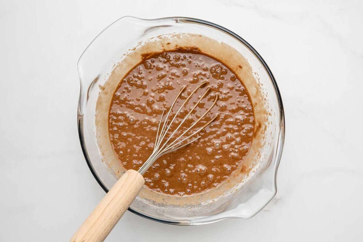 Whisking batter for wacky cake.