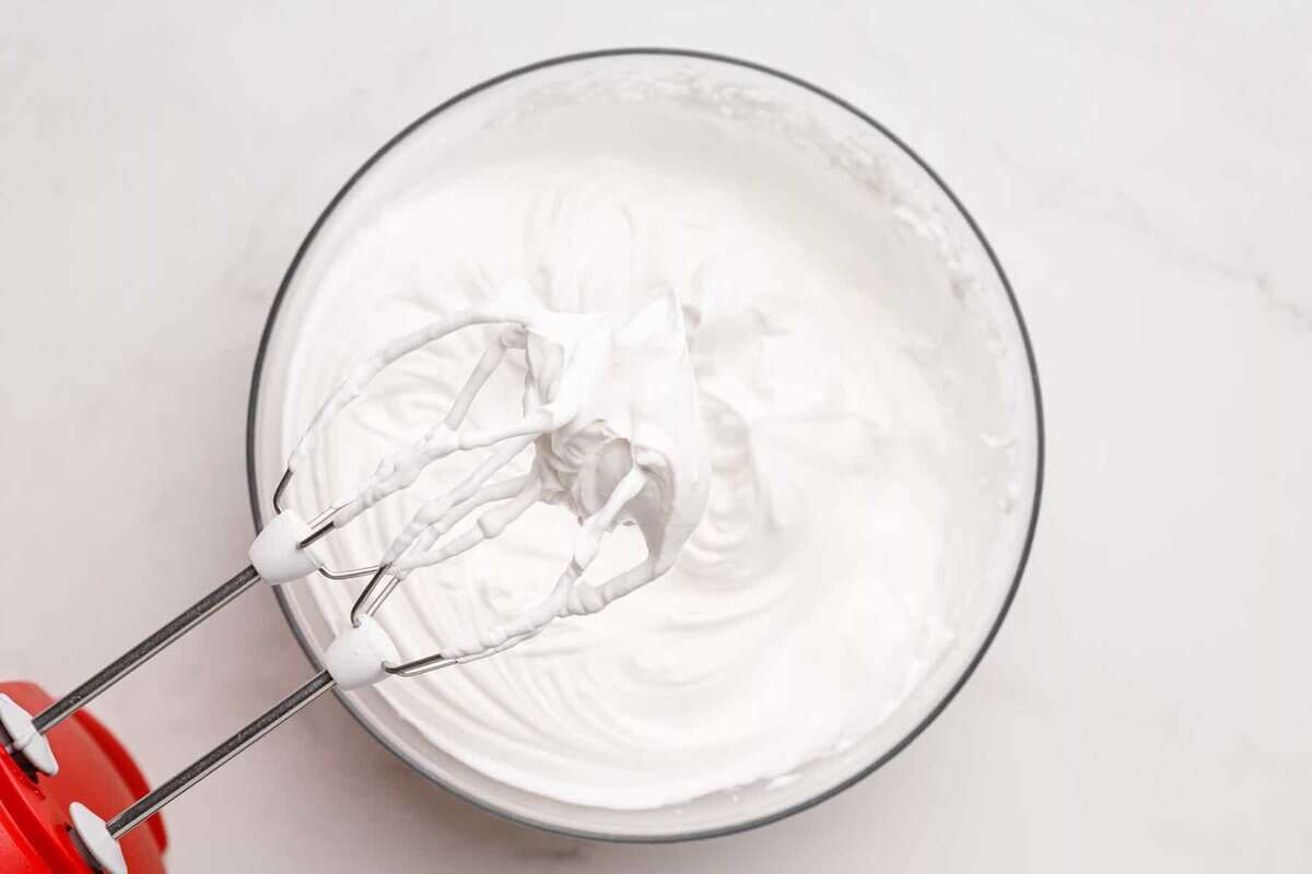 Homemade whipped cream beaten to soft peaks.