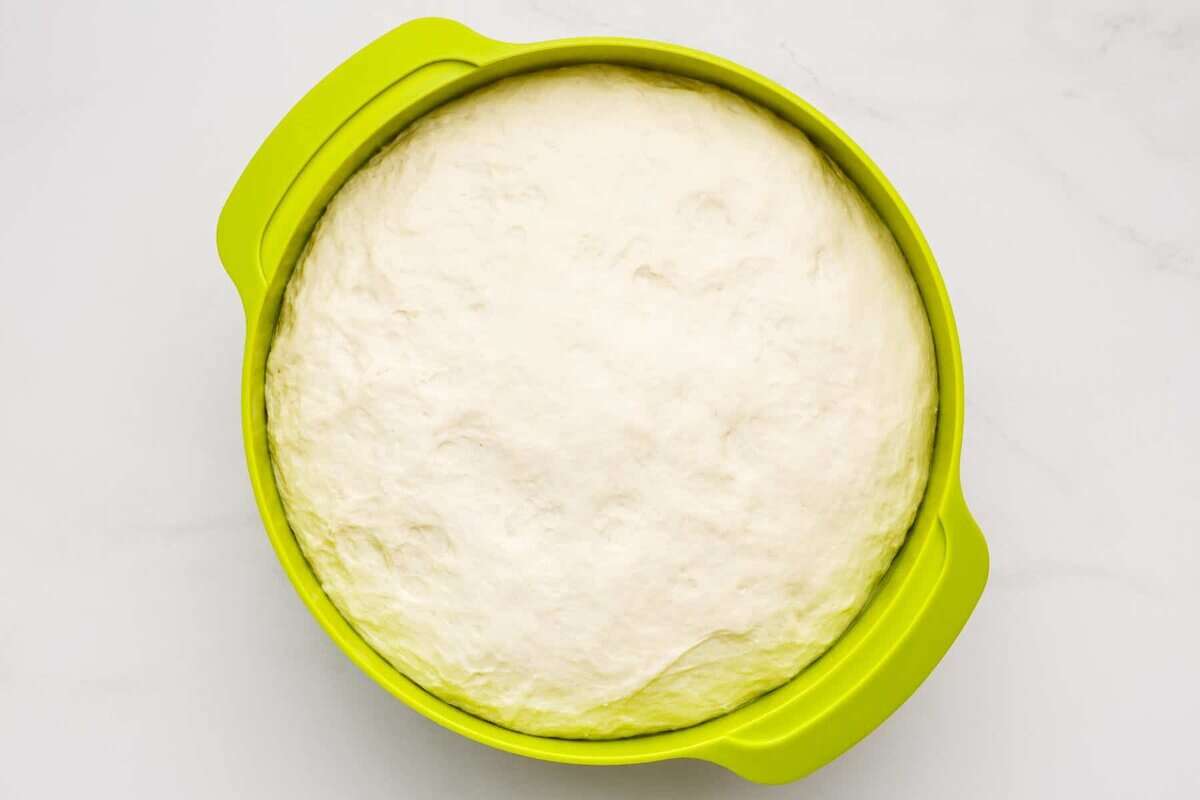 White sandwich bread dough in bowl after rising.