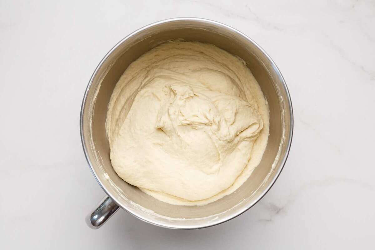 Sandwich bread dough in mixing bowl.