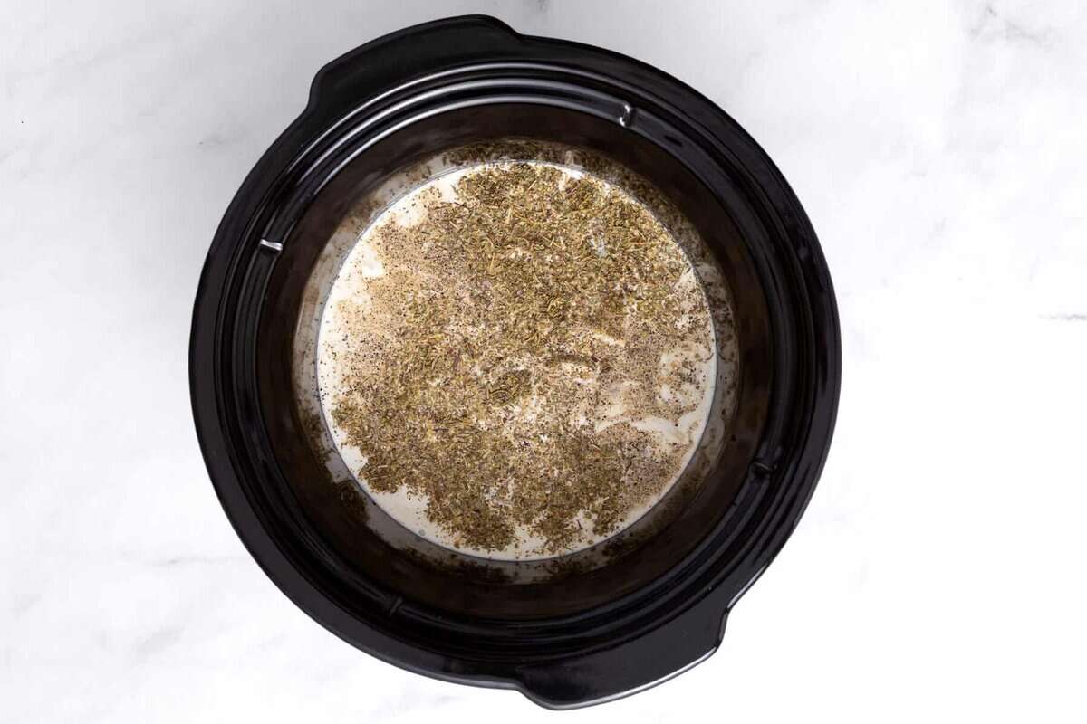 Ingredients for chicken alfredo sauce in crockpot.