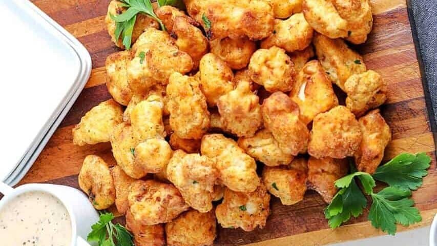 air fryer popcorn chicken on a cutting board