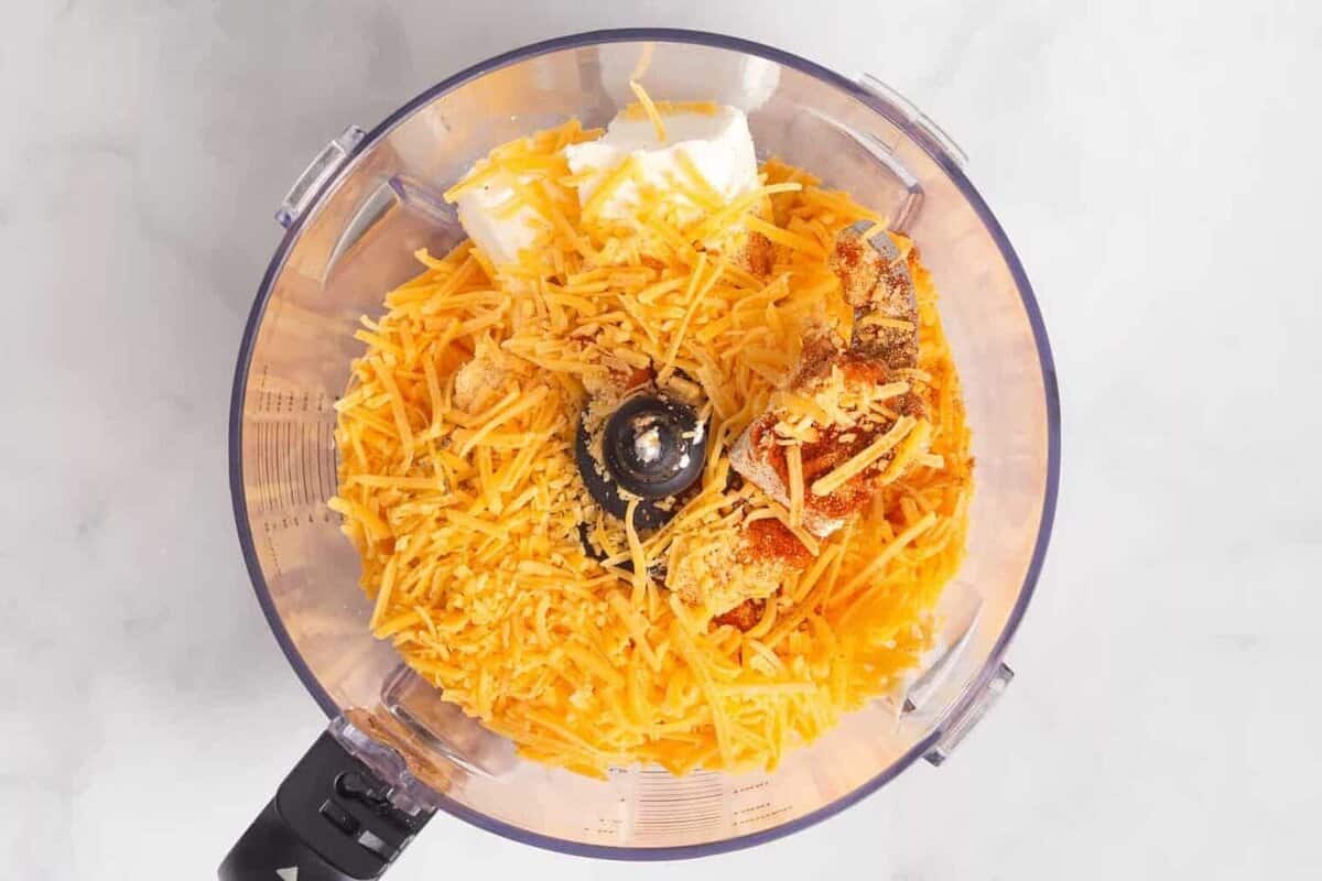 Ingredients for pimento cheese in food process.