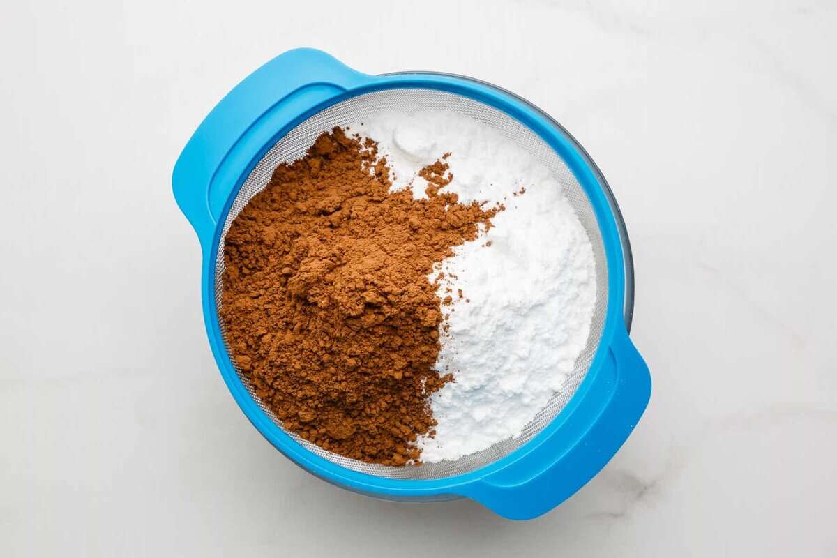 Cocoa powder and powdered sugar in bowl.