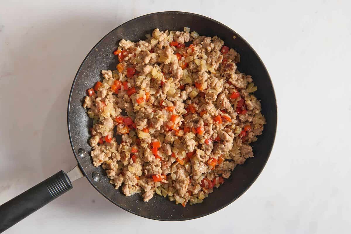 Sausage and veggies in skillet.
