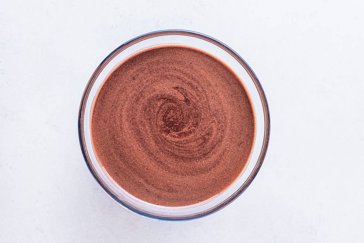 Homemade chocolate cake batter in bowl.
