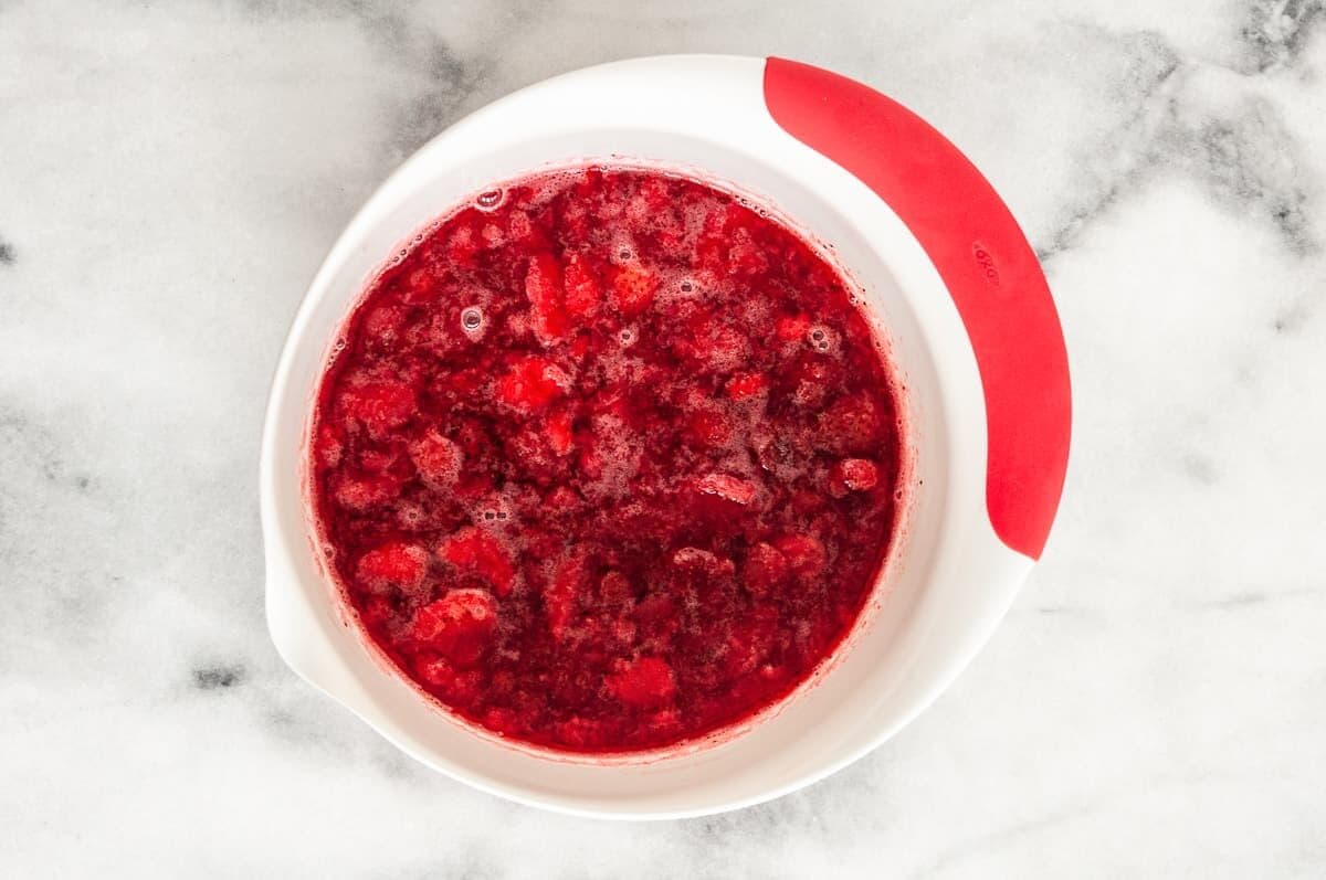 Jello and strawberries in bowl.
