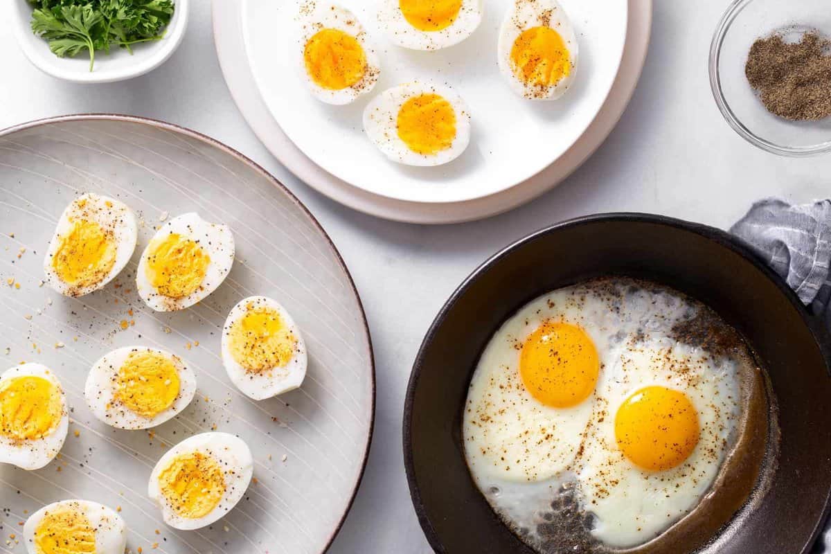 Plates of soft, hard, and fried eggs made in the air fryer.