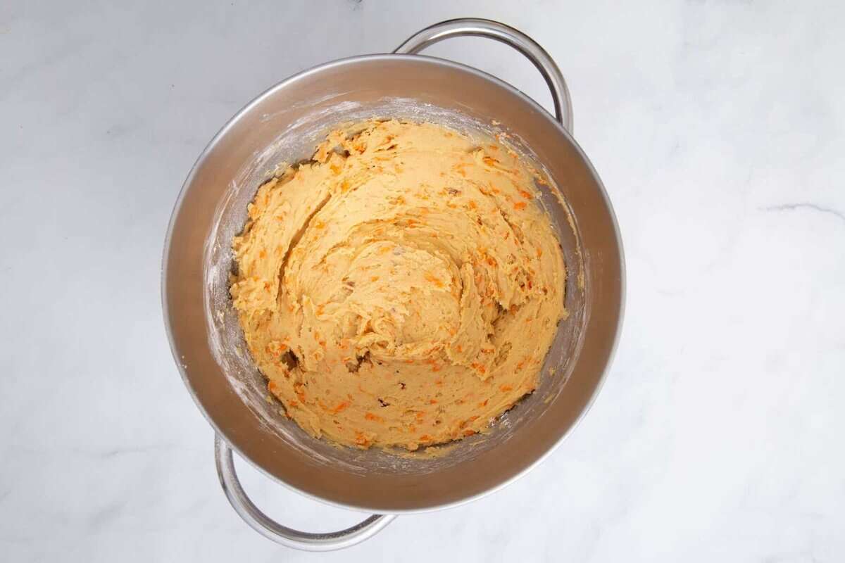 Carrot cake cookie dough in bowl.