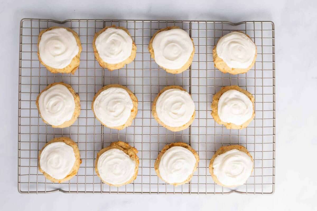Frosted carrot cake cookies with cream cheese frosting.