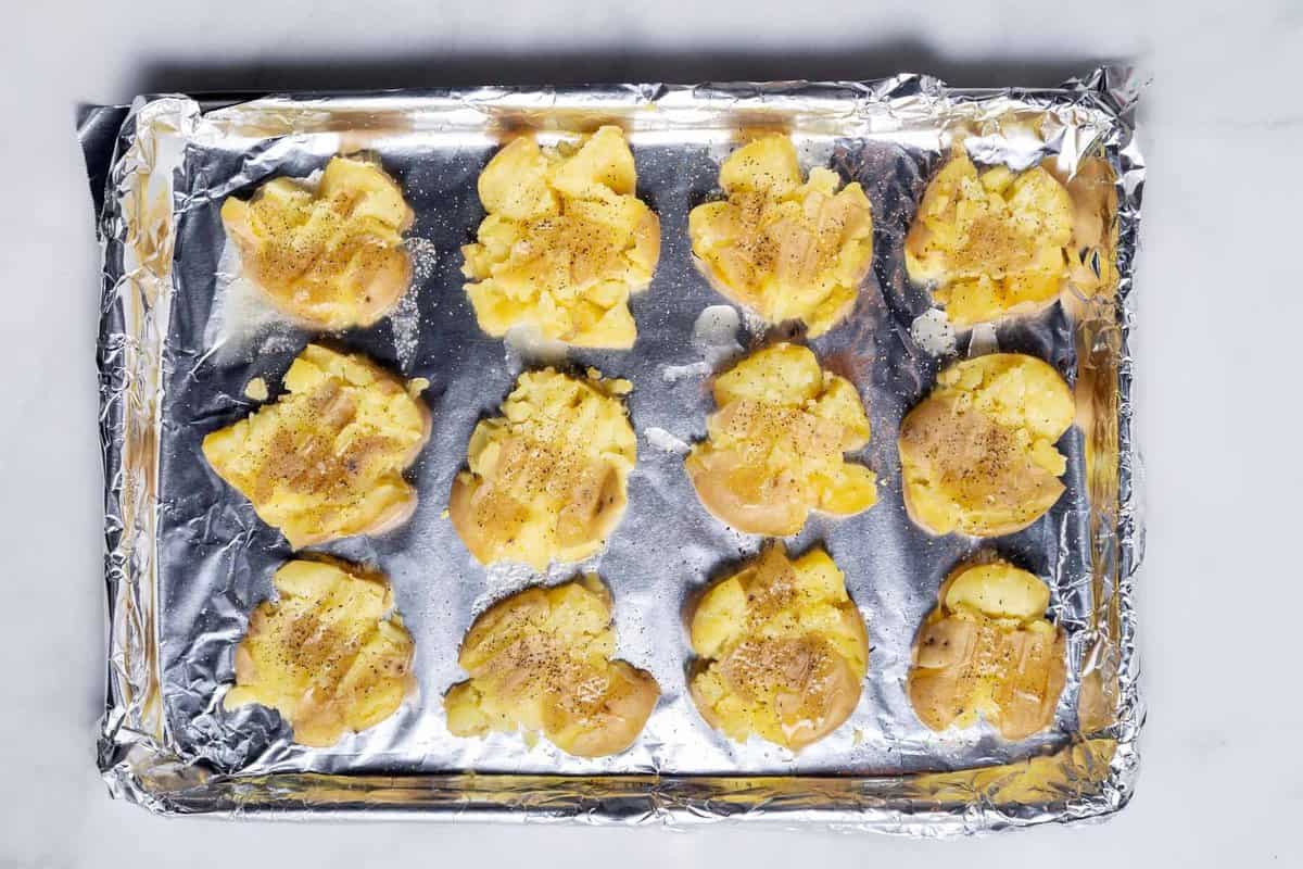 Smashed potatoes after adding butter, salt, and pepper.