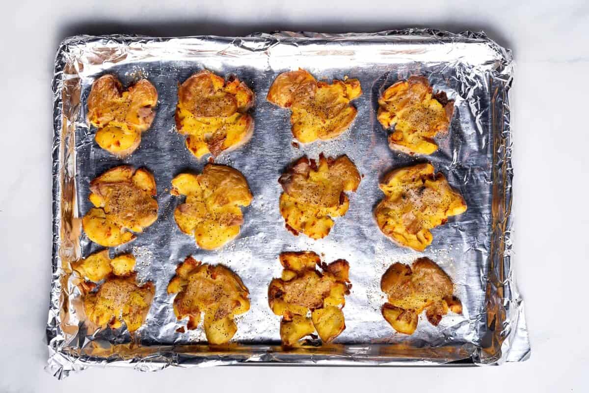 Crispy smashed potatoes on sheet pan.