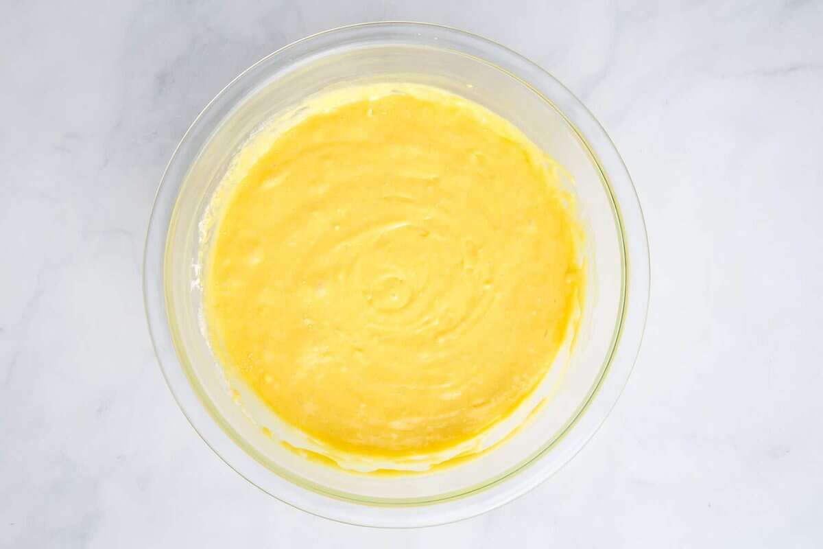 Lemonade cake batter in glass bowl.