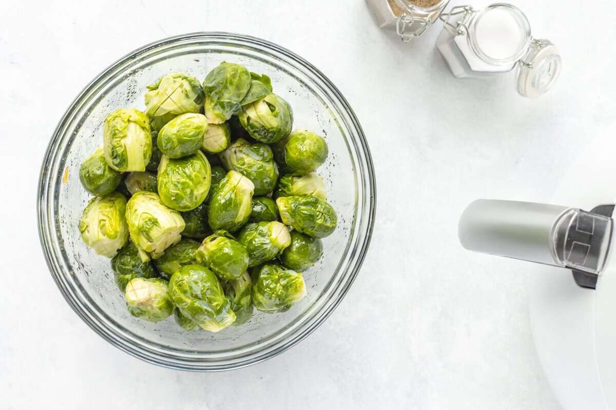 Brussels sprouts in bowl before cooking.