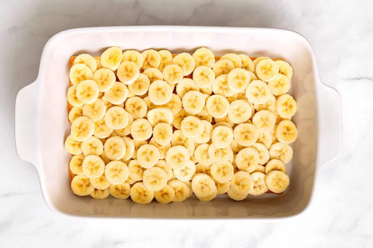 Layer of bananas in casserole dish.