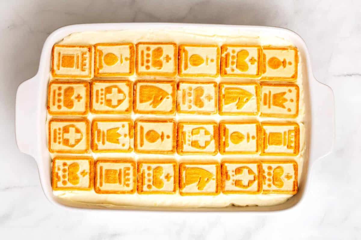 Banana pudding with chessman cookies in casserole dish.