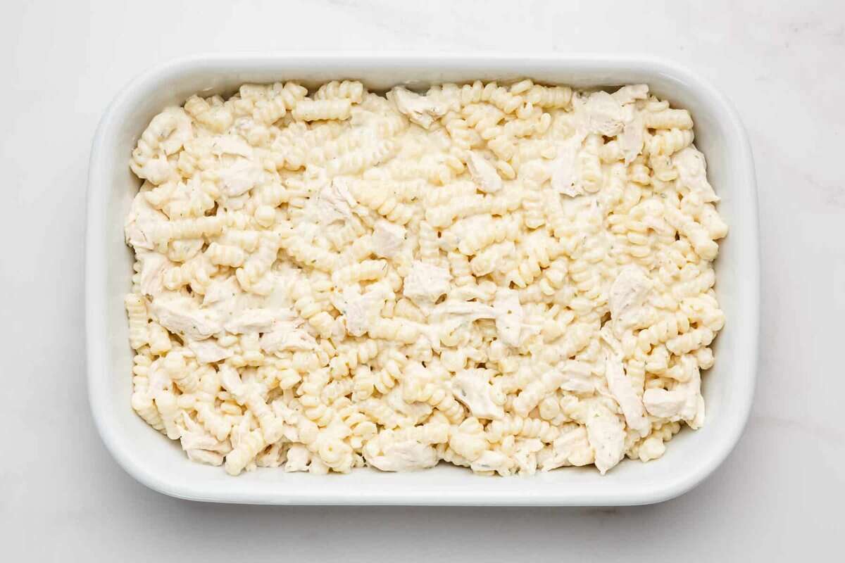 Chicken bacon ranch casserole in baking dish before adding toppings.