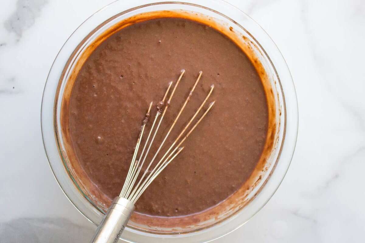 Bowl of pudding with whisk.