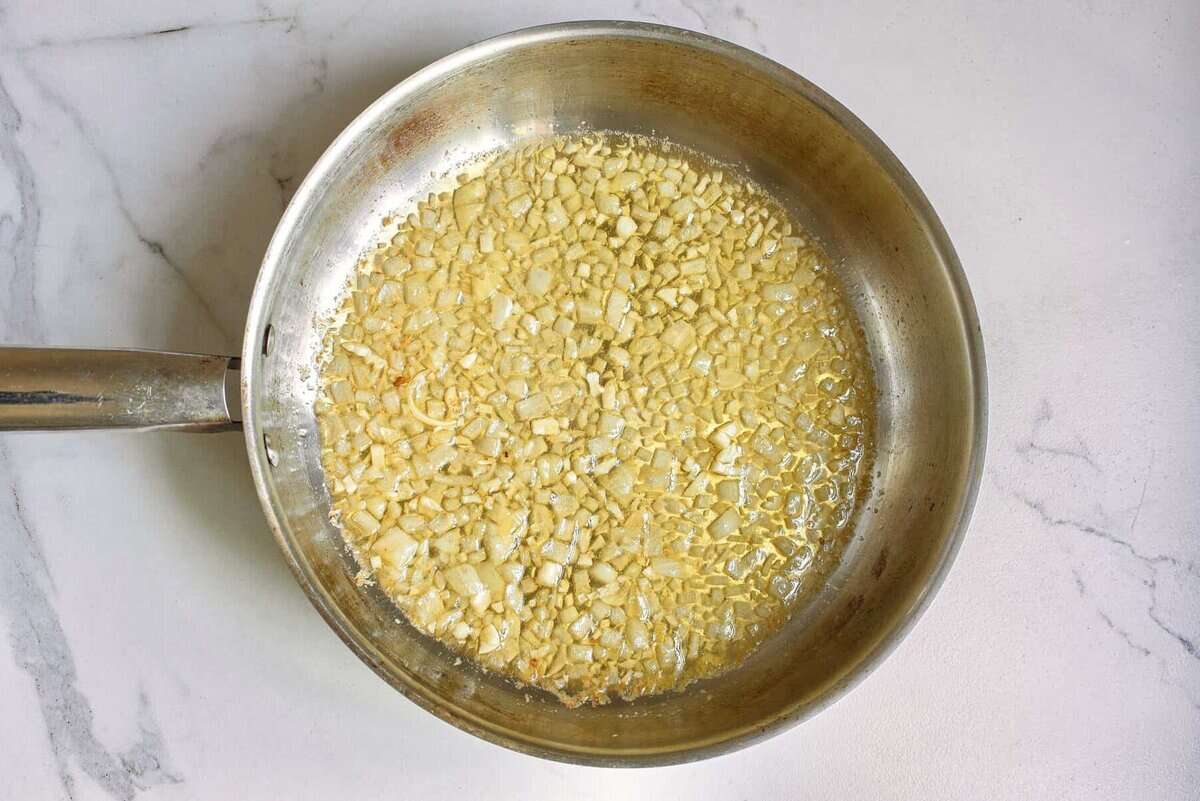 Onion and garlic cooking in pan.