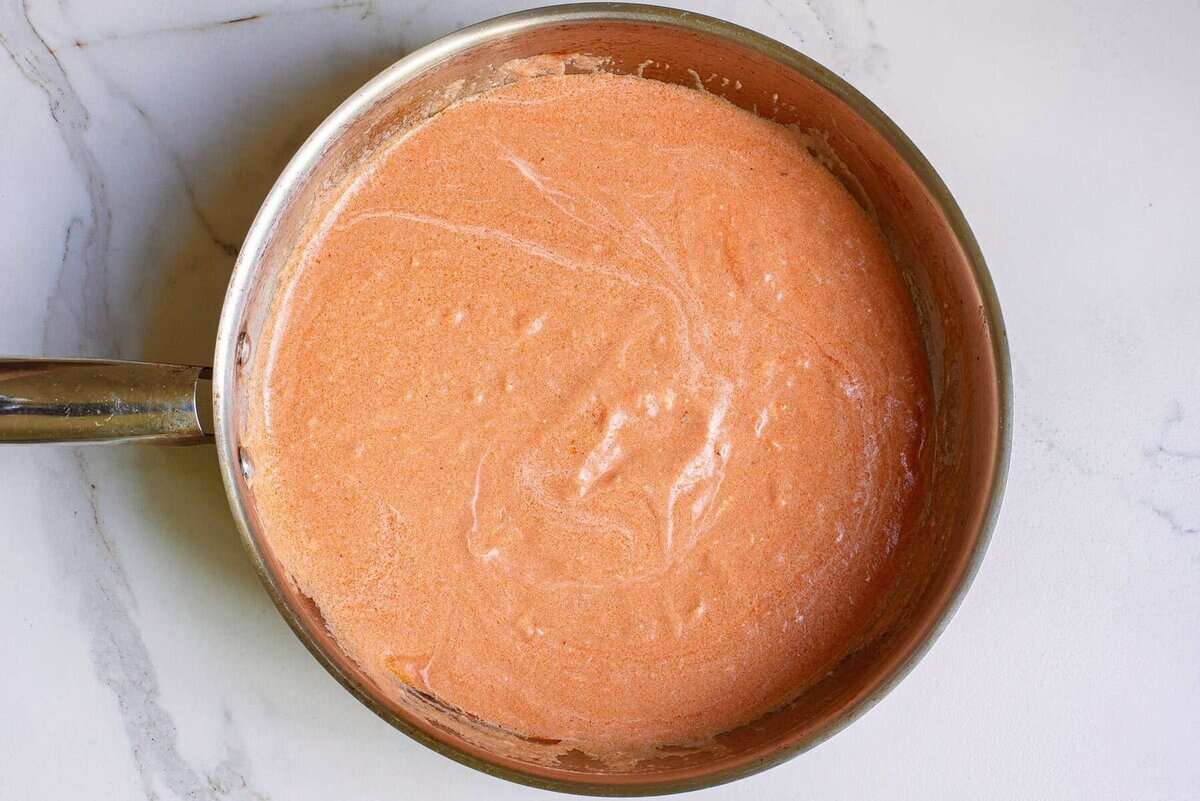 Tomato cream sauce in skillet.