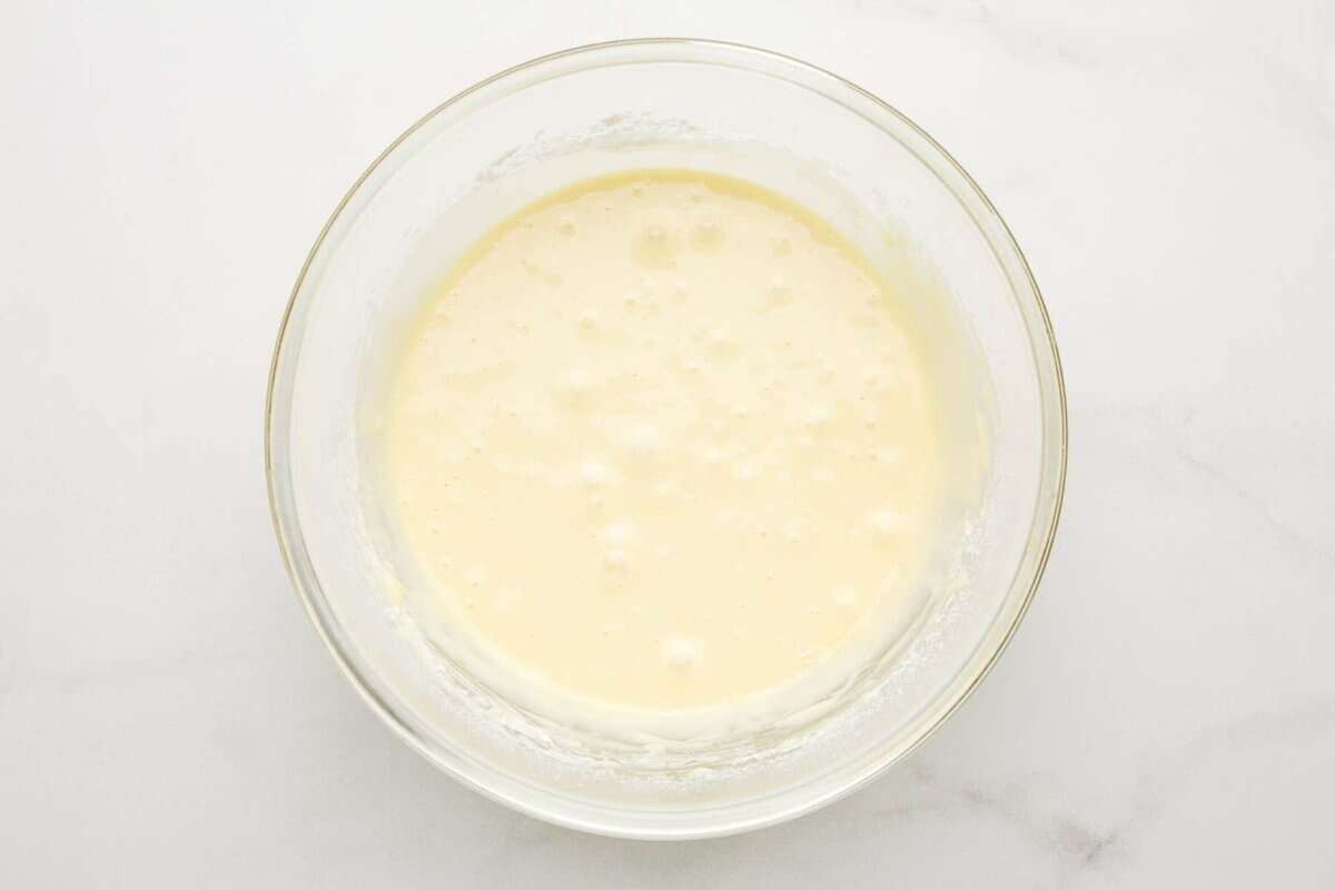 White cake batter in bowl.