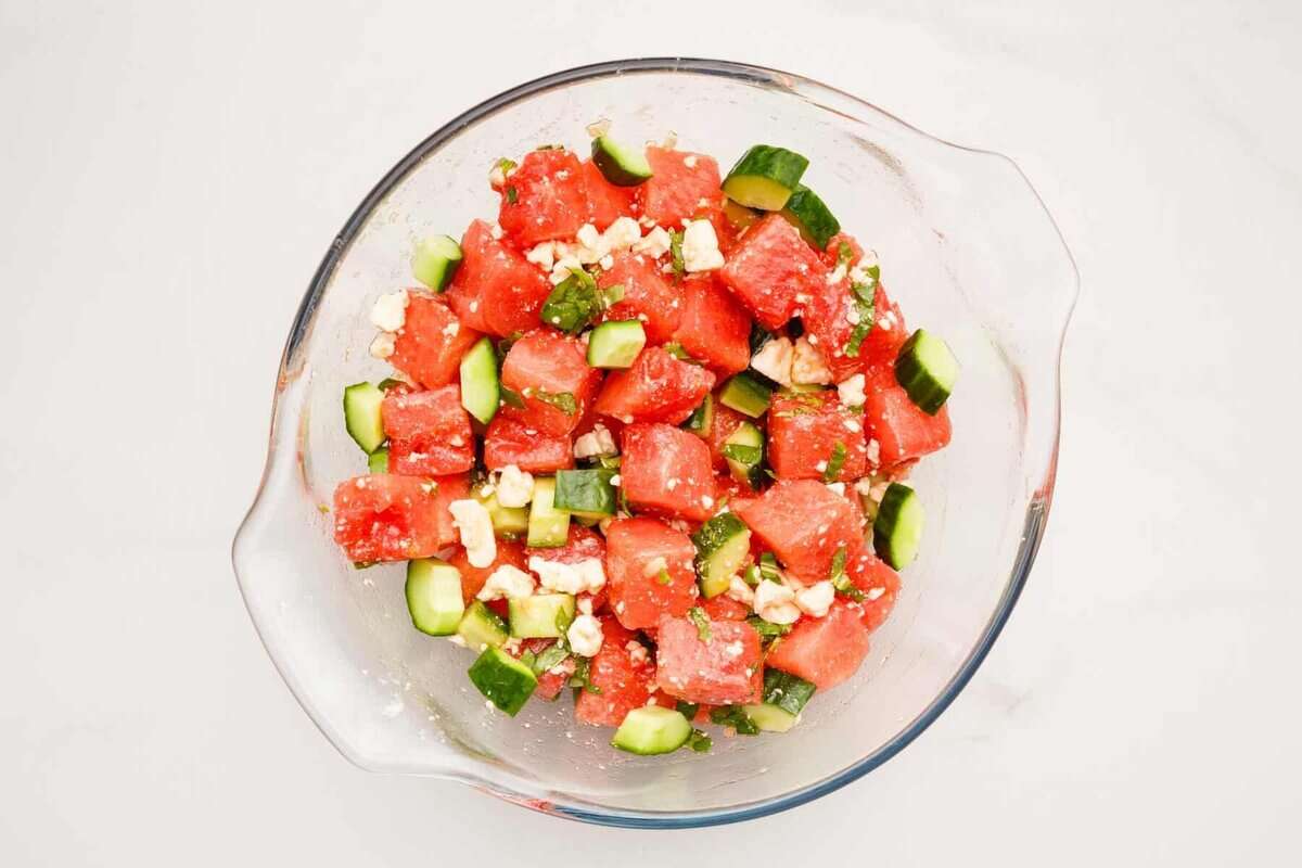 Watermelon, feta and cucumber salad in bowl.