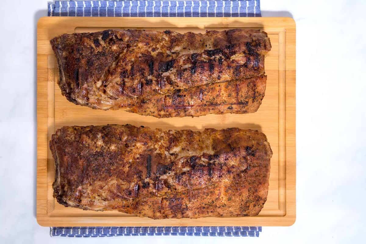 BBQ pork ribs on cutting board.