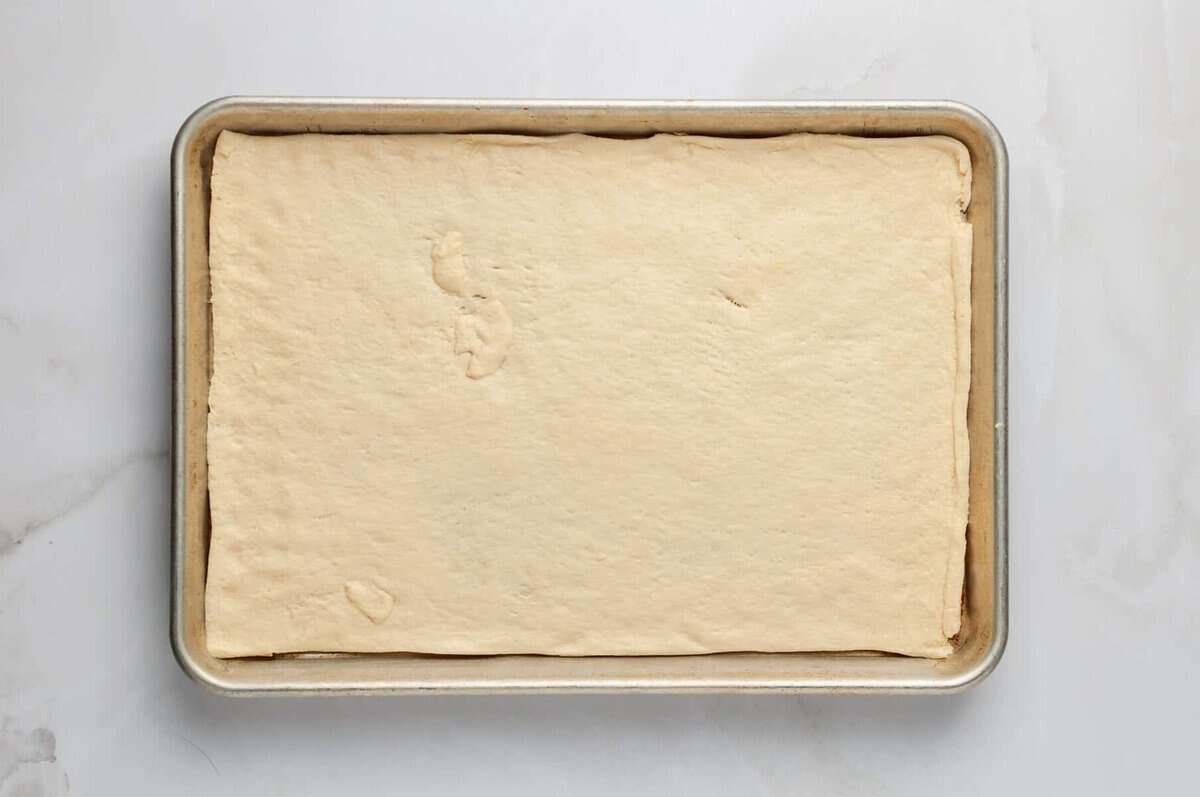 Crescent roll crust in pan.