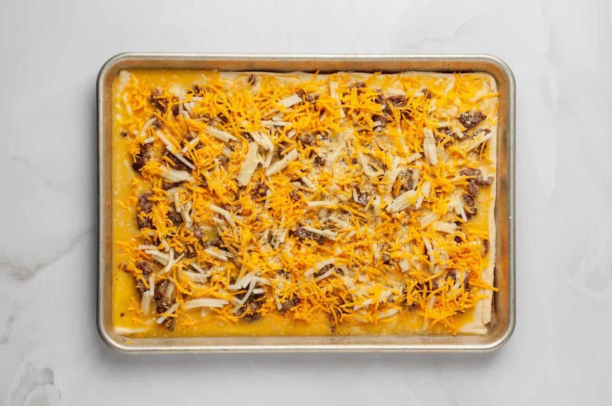 Breakfast pizza before baking.