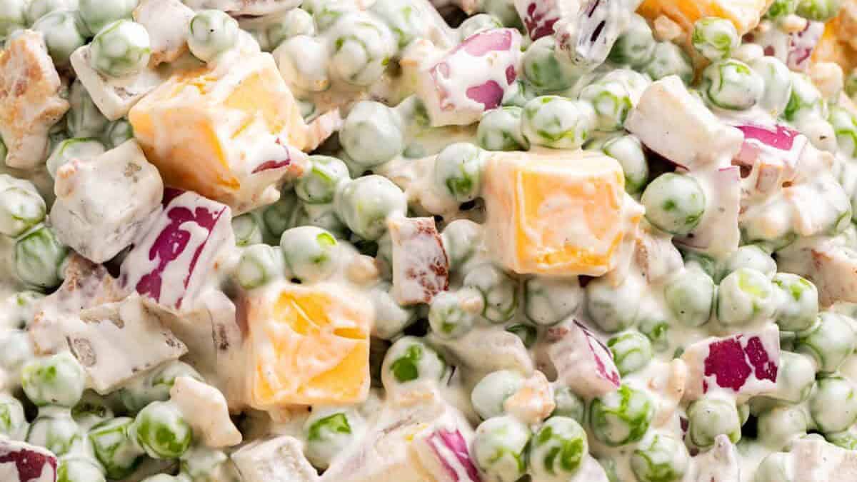 Sweet pea salad in a bowl on a countertop.