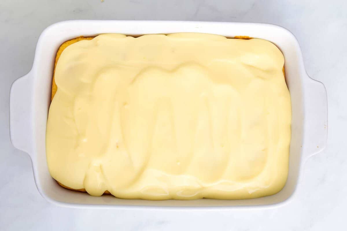 Pudding spread over cake.