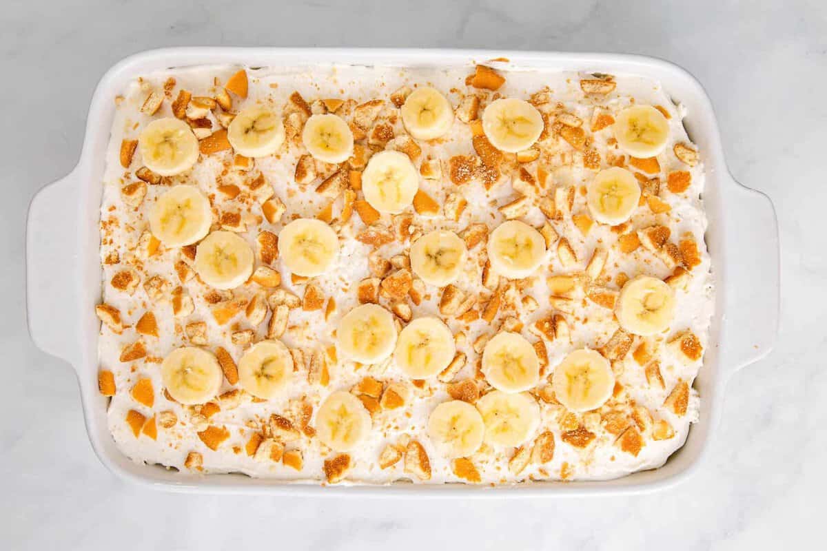 Banana pudding poke cake in pan.