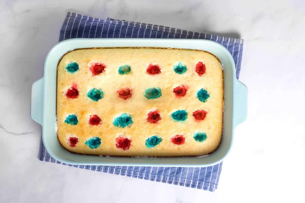 Red and blue jello added to poke cake.