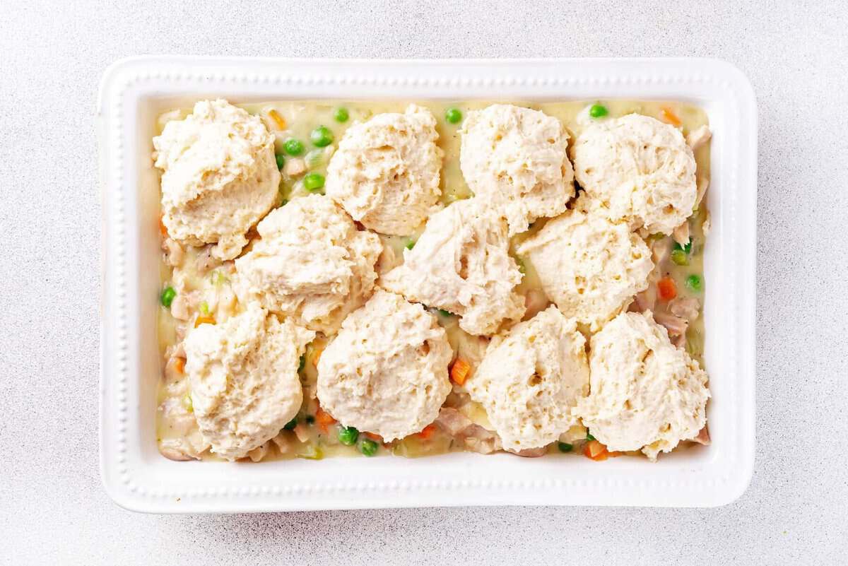 Chicken and dumplings casserole in pan before baking.