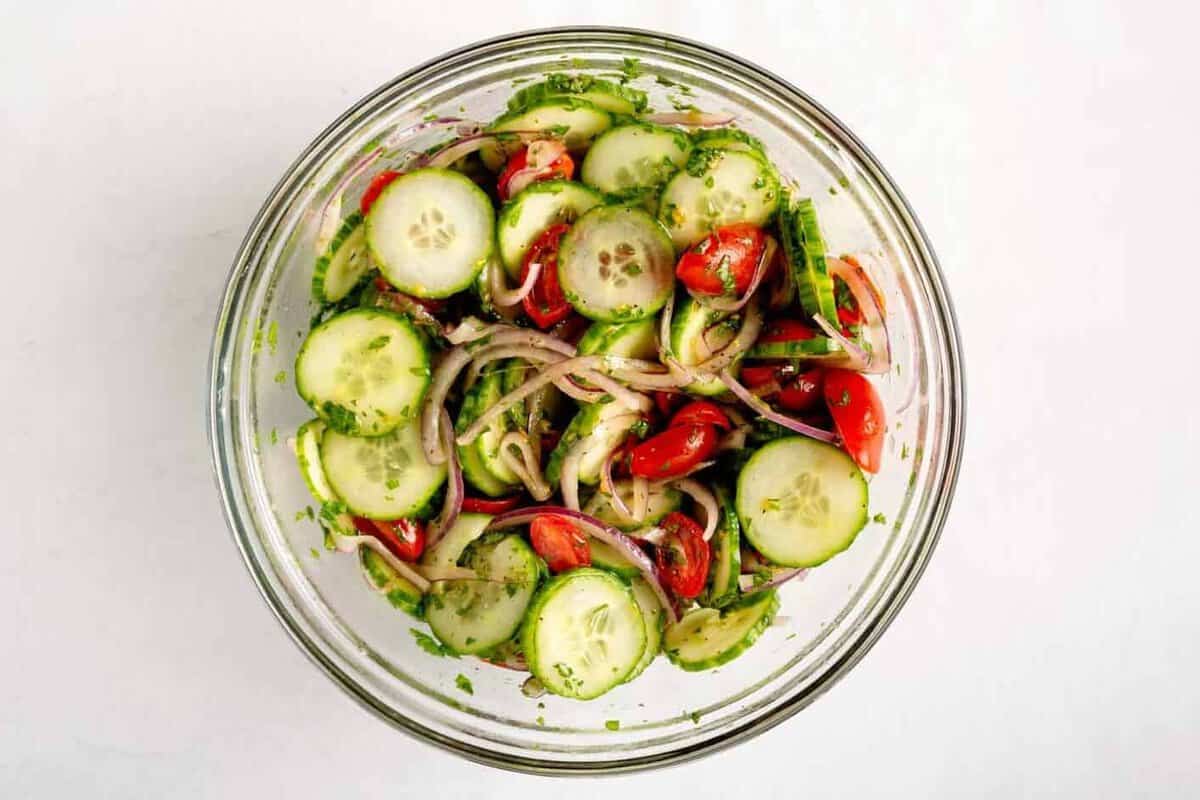 Cucumber tomato salad in bowl.