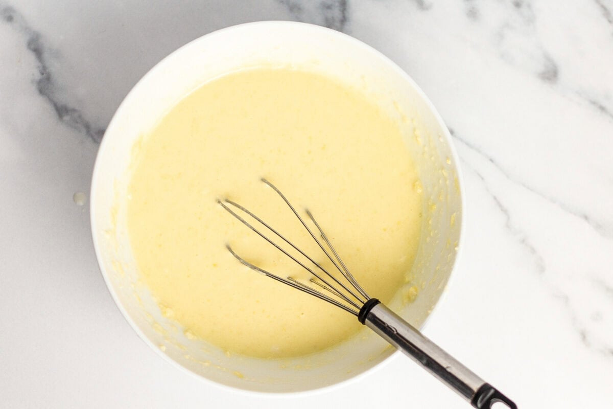 Bisquick batter in bowl with whisk.